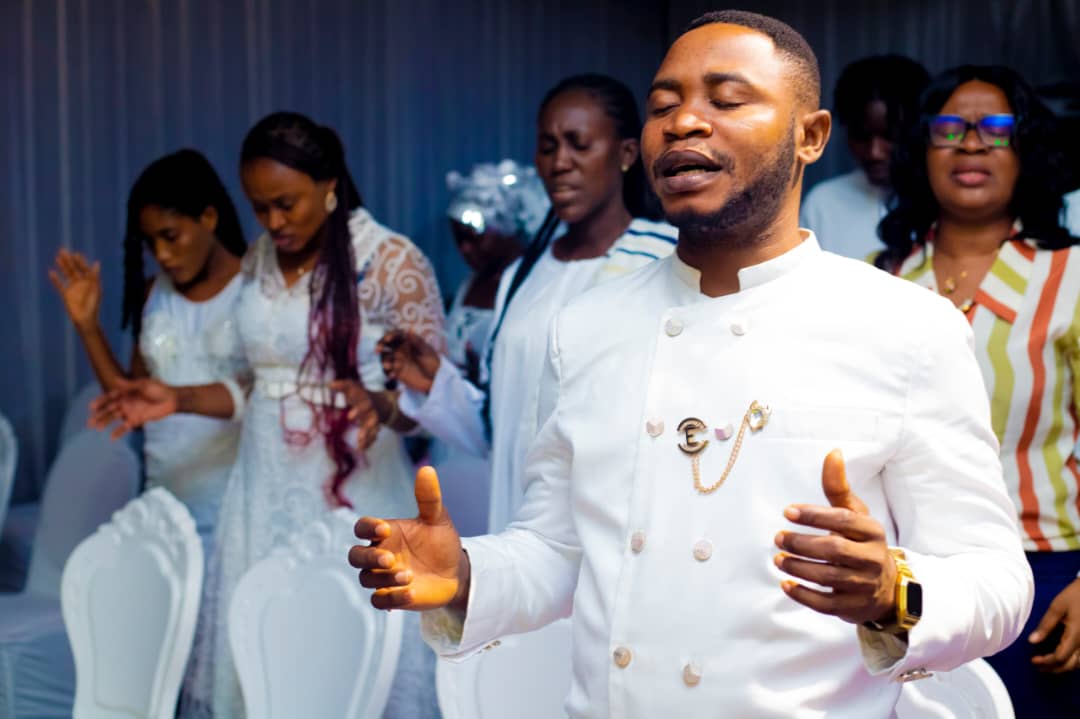 Associate Pastor in prayer at Emet House Chapel